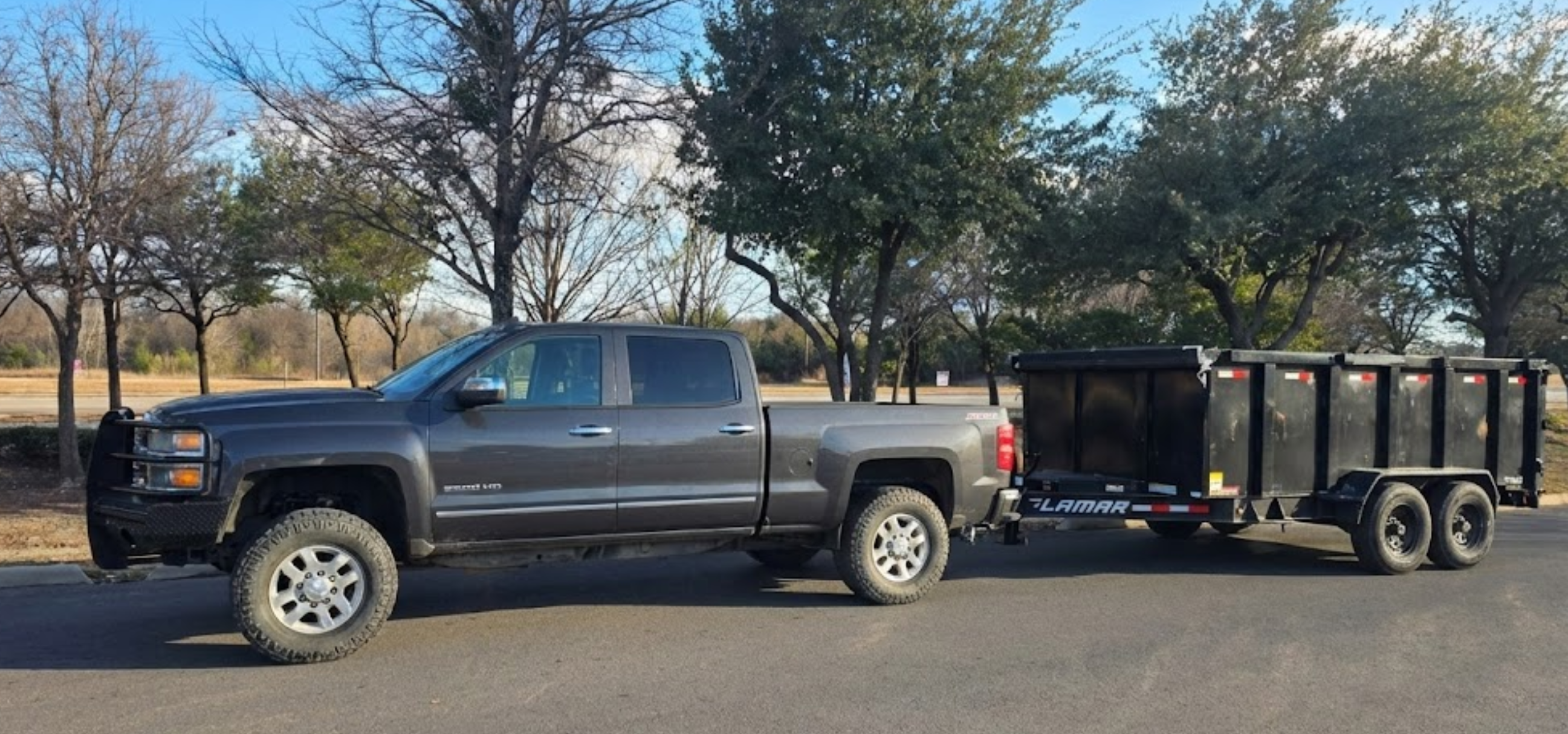 JLTM Junk Removal truck and trailer ready for pickup